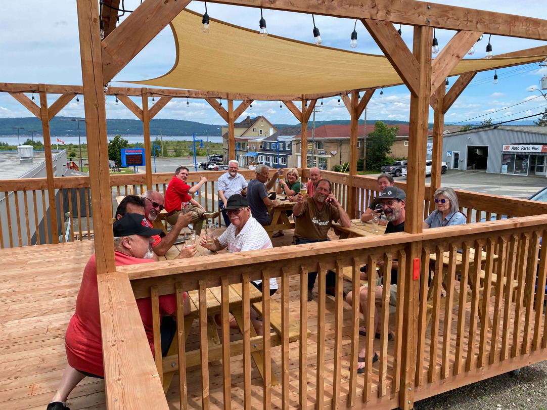 Heron Bay Brewing patio with happy people